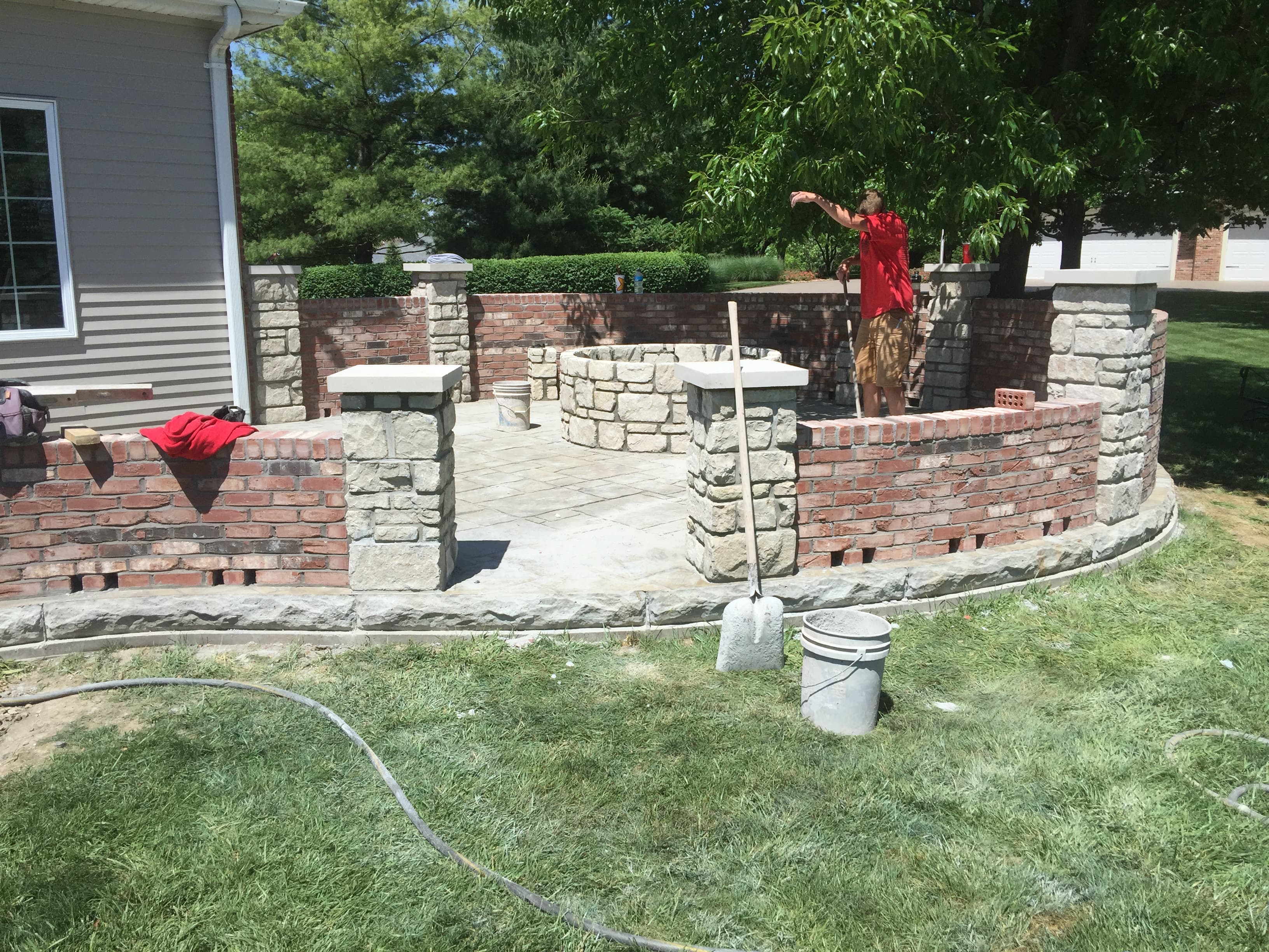 Curved brick & stone patio wall (in progress)