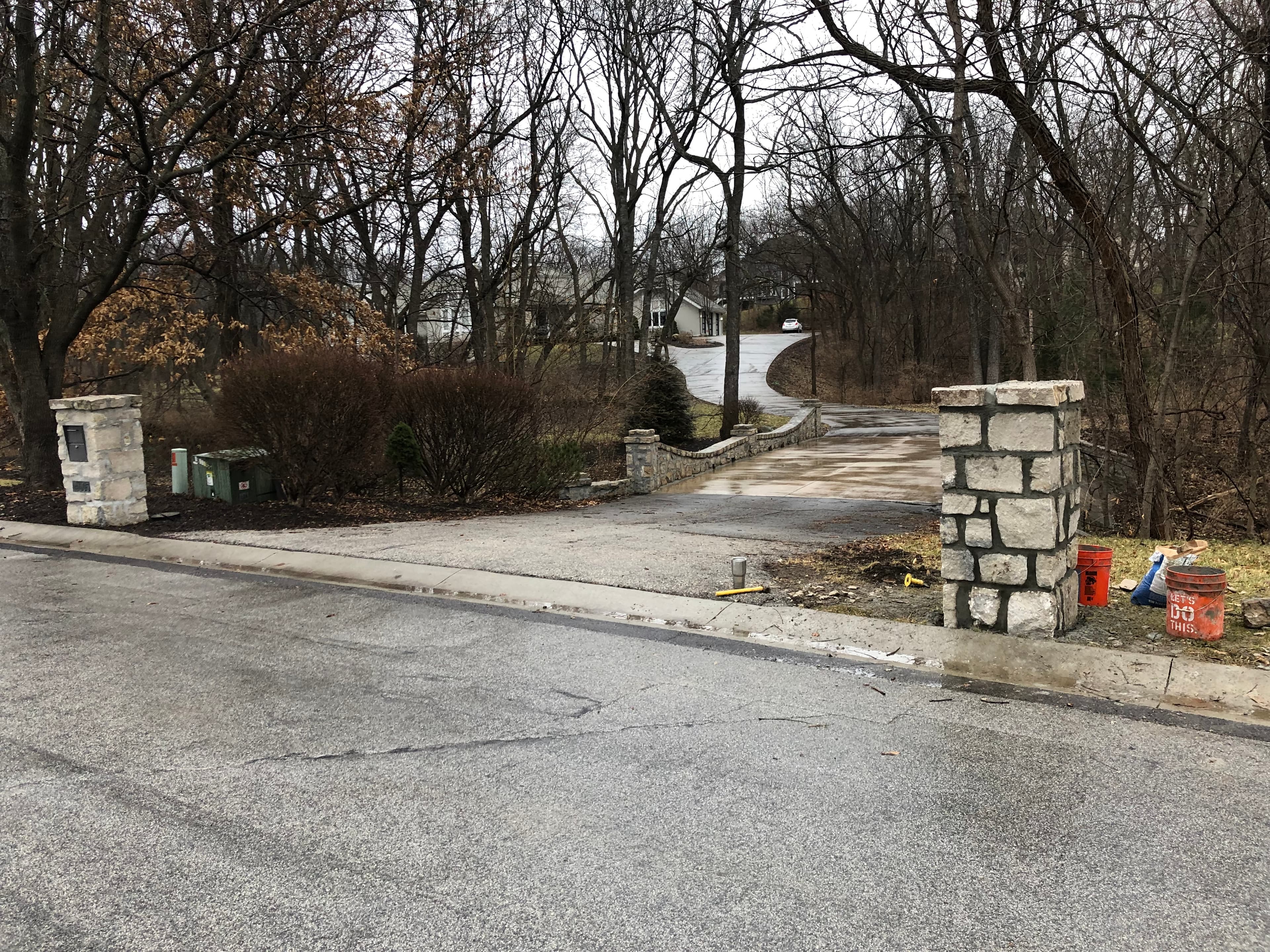 Driveway stone pillars & walls with mailbox