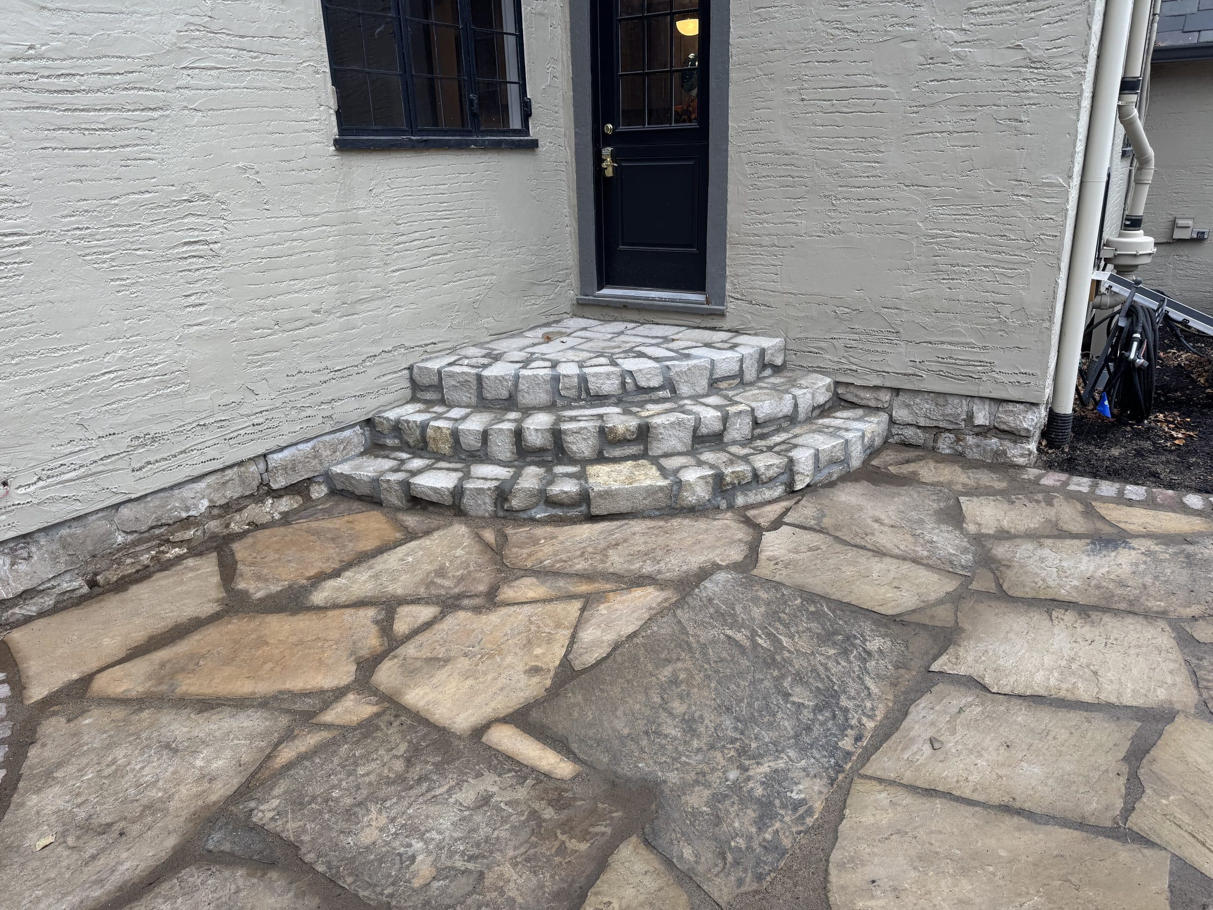 Flagstone patio with curved stone steps
