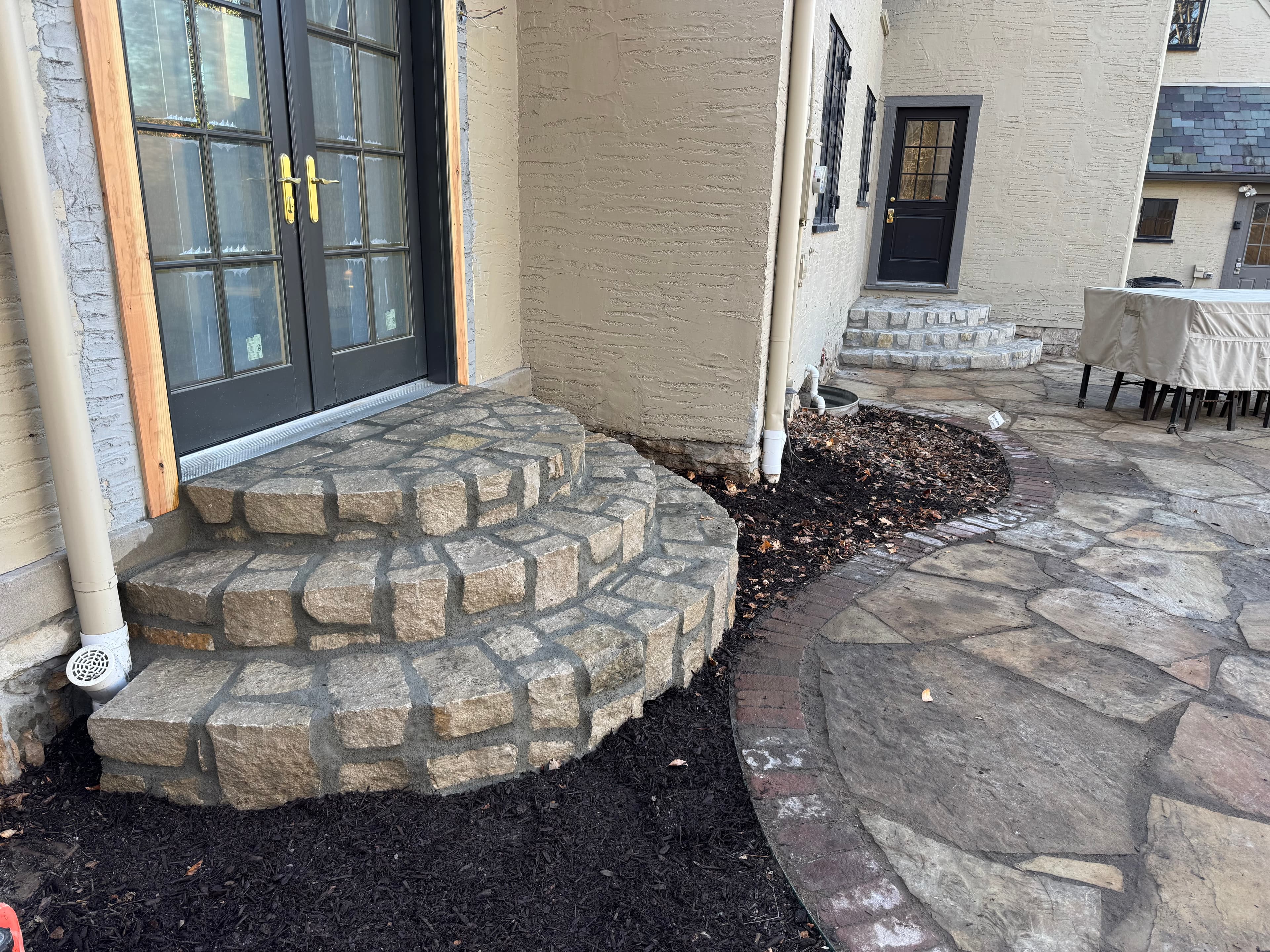 Flagstone patio and twin stone stair sets