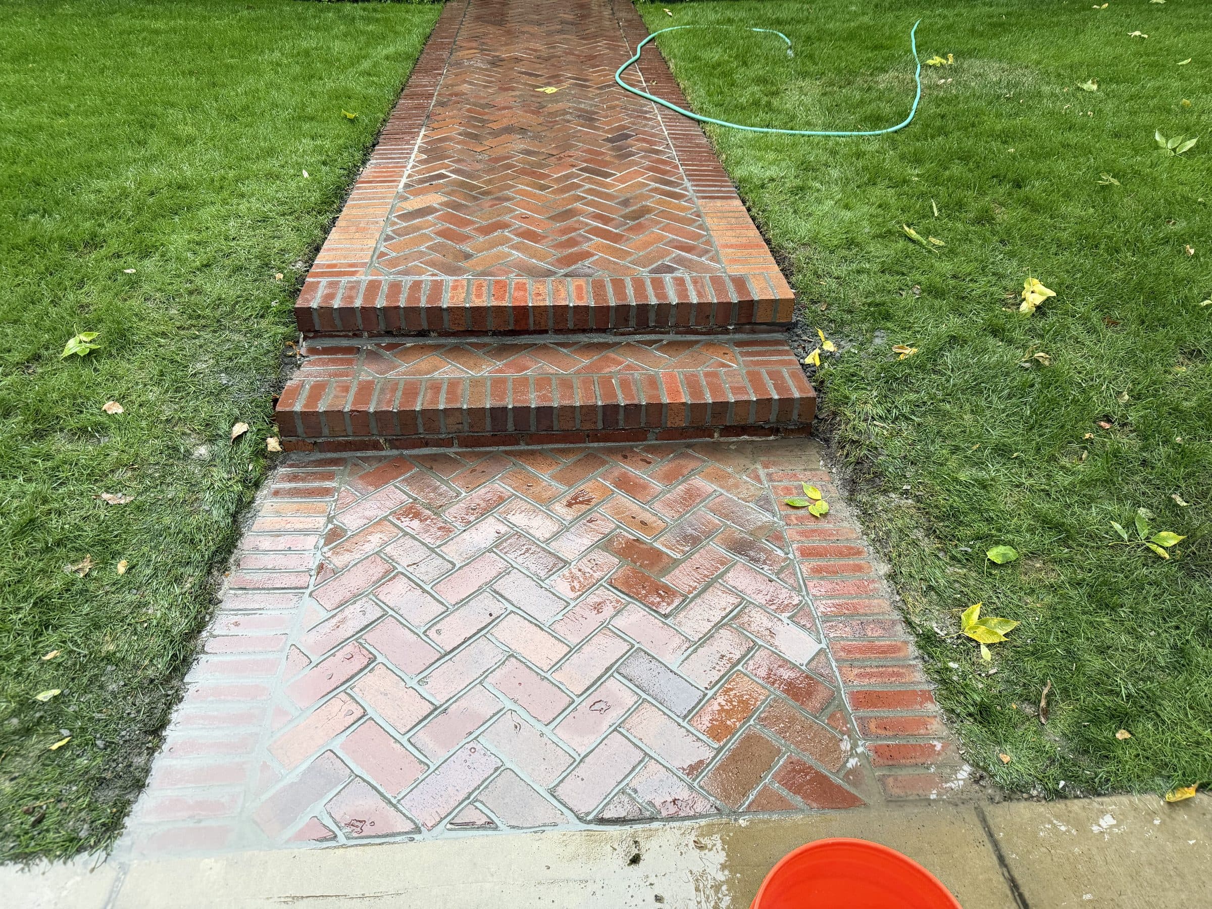 Brick herringbone walkway with steps