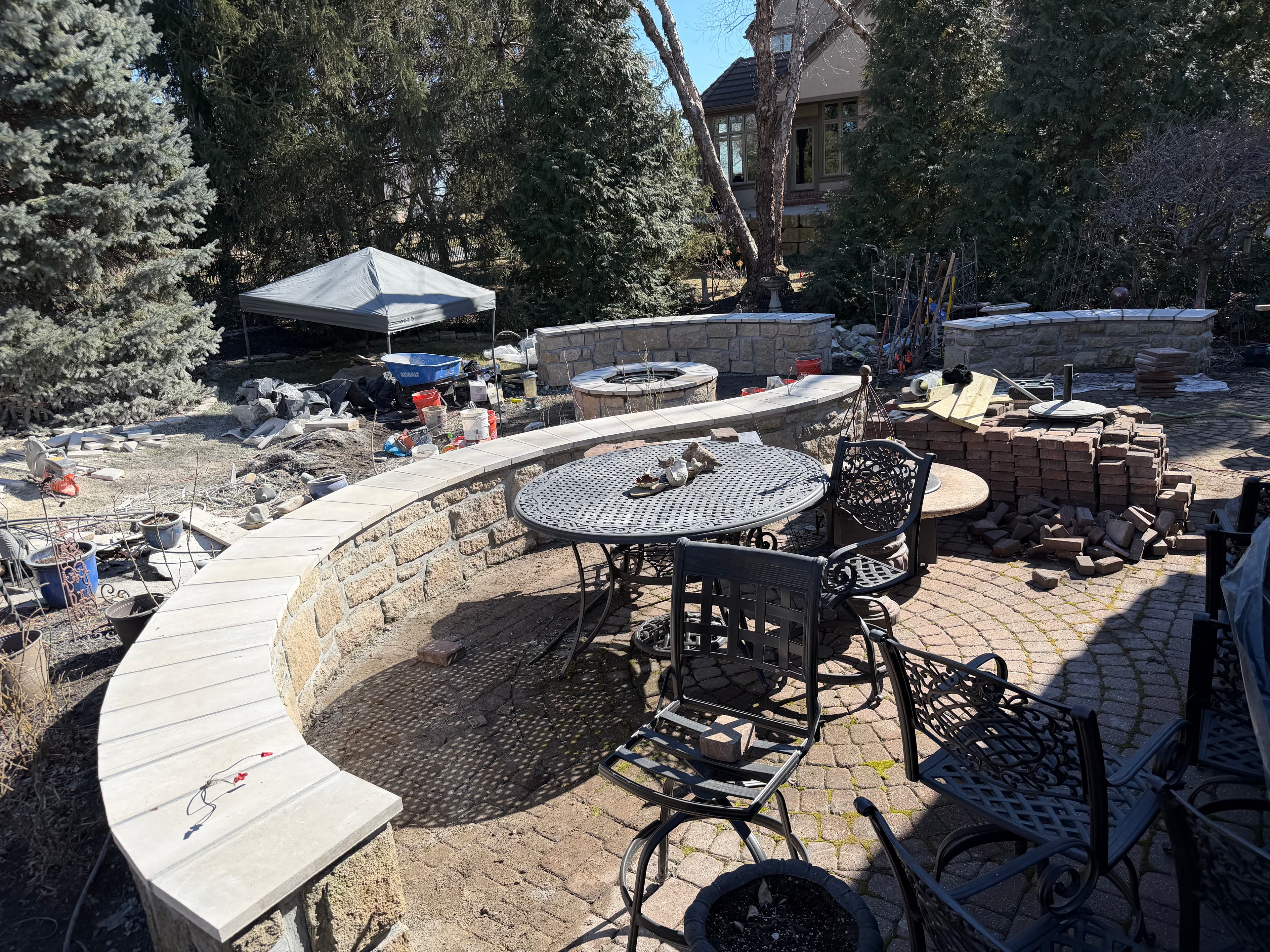 Stone seating wall + patio (in progress)